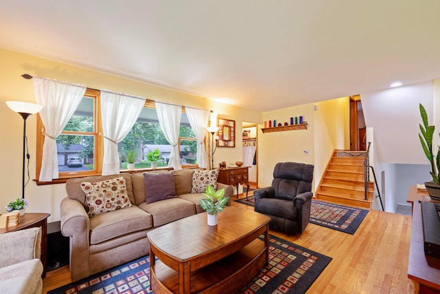 582 E Stanton Ave, Columbus, OH 43214 - living room with wood finished floors, stairway, and recessed lighting
