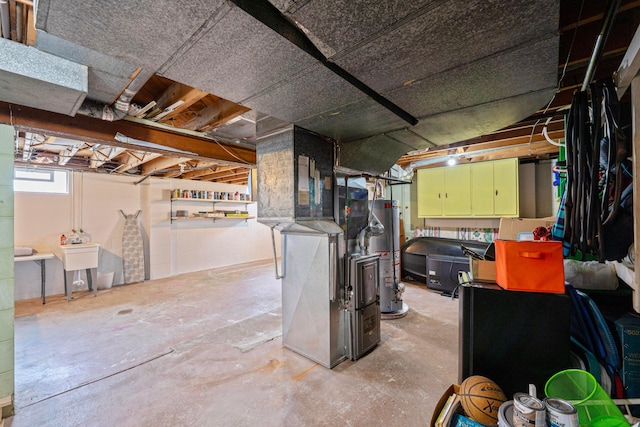 582 E Stanton Ave, Columbus, OH 43214 - basement featuring gas water heater and heating unit