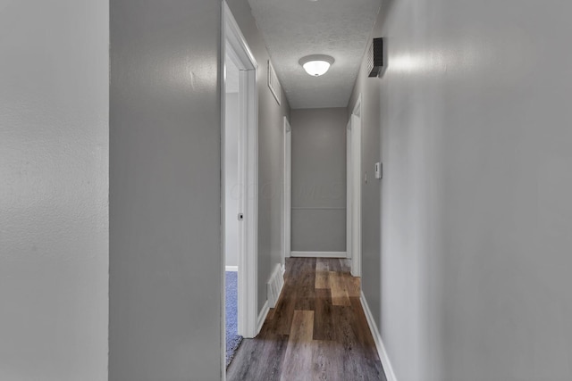 2103 Rochelle Pl, Columbus, OH 43232 - hallway featuring wood finished floors and a textured ceiling