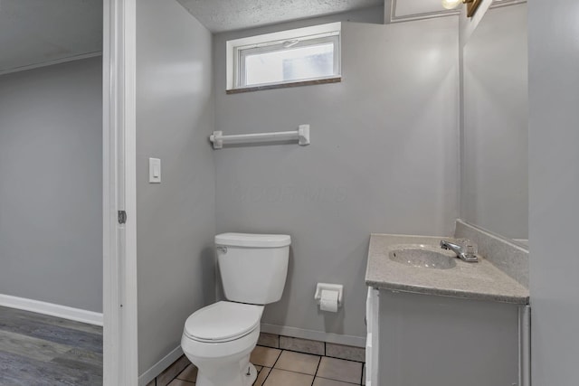 2103 Rochelle Pl, Columbus, OH 43232 - half bathroom with vanity, a textured ceiling, and tile patterned flooring