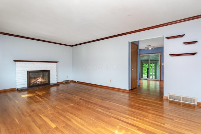 4453 Marland Dr, Columbus, OH 43224 - unfurnished living room with light wood-type flooring, a fireplace, and ornamental molding