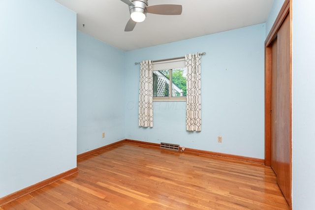 4453 Marland Dr, Columbus, OH 43224 - unfurnished bedroom featuring light wood-style flooring, a closet, and a ceiling fan