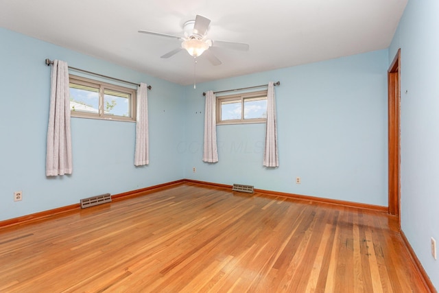 4453 Marland Dr, Columbus, OH 43224 - spare room with healthy amount of natural light, hardwood / wood-style flooring, and ceiling fan