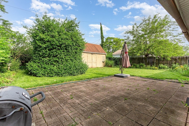 4453 Marland Dr, Columbus, OH 43224 - fenced backyard with a patio and a storage unit