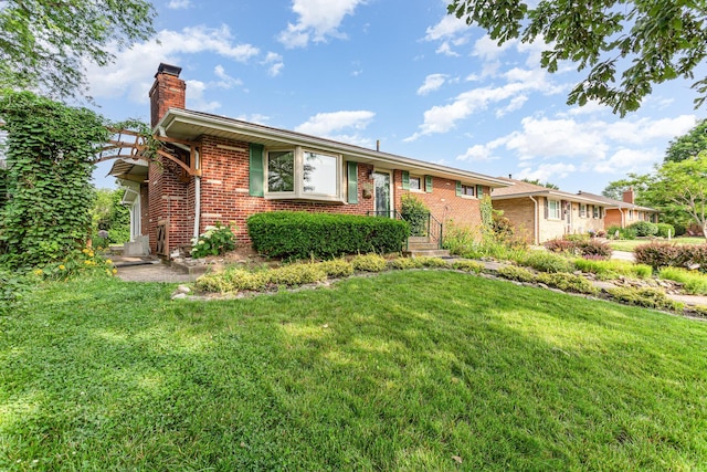 4453 Marland Dr, Columbus, OH 43224 - single story home featuring a chimney, brick siding, and a front yard