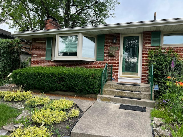 4453 Marland Dr, Columbus, OH 43224 - entrance to property featuring a chimney and brick siding