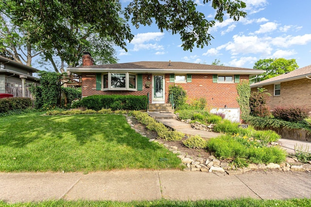 4453 Marland Dr, Columbus, OH 43224 - ranch-style house featuring a chimney, brick siding, and a front yard