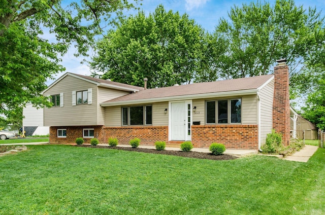 3623 Bolamo Dr, Westerville, OH 43081 - tri-level home with brick siding, a front lawn, and a chimney