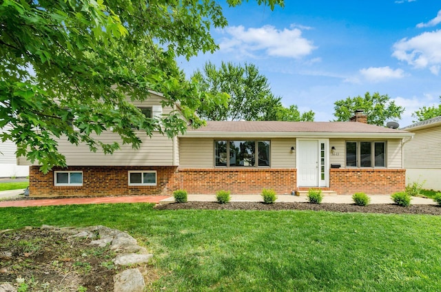 3623 Bolamo Dr, Westerville, OH 43081 - split level home with a front lawn, a chimney, and brick siding