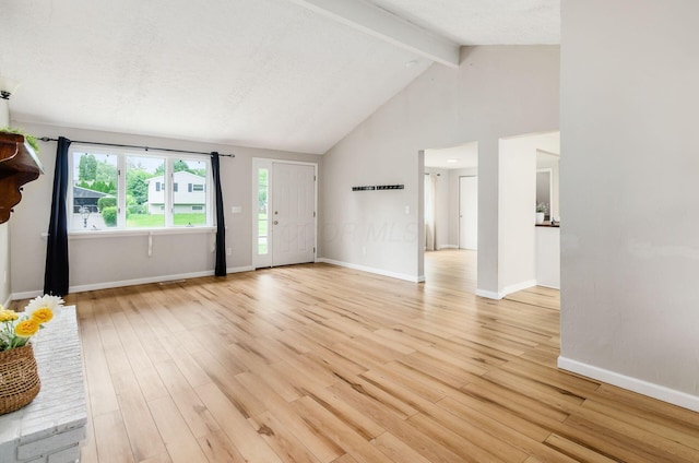 3623 Bolamo Dr, Westerville, OH 43081 - unfurnished living room featuring beam ceiling, light wood finished floors, and high vaulted ceiling