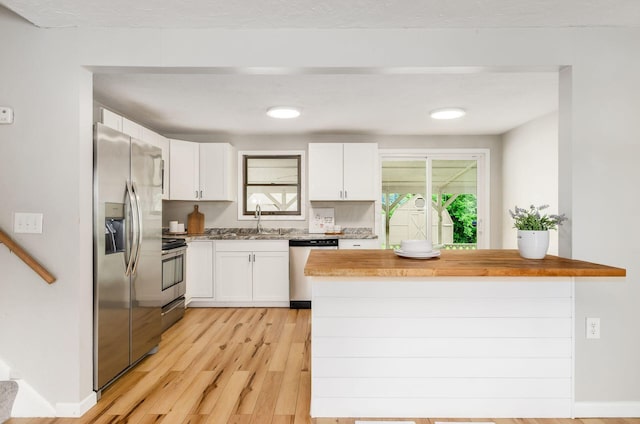 3623 Bolamo Dr, Westerville, OH 43081 - kitchen with appliances with stainless steel finishes, white cabinetry, light wood-style flooring, and light countertops