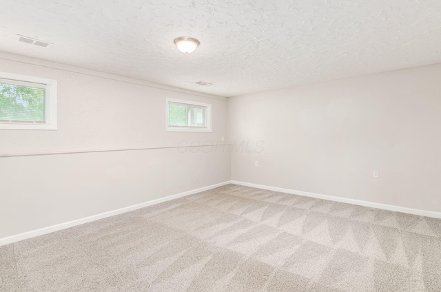 3623 Bolamo Dr, Westerville, OH 43081 - carpeted empty room featuring healthy amount of natural light and a textured ceiling