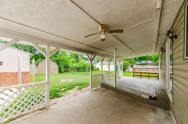 3623 Bolamo Dr, Westerville, OH 43081 - fenced backyard featuring a storage unit, a ceiling fan, a patio, and a deck