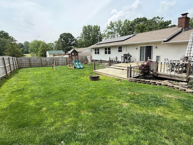 1819 Walnut Rd, Heath, OH 43056 - fenced backyard with a playground and a deck