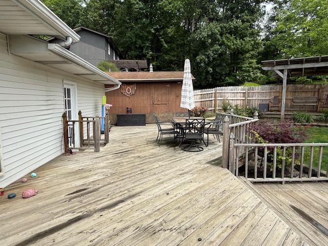 1819 Walnut Rd, Heath, OH 43056 - wooden terrace featuring outdoor dining space and view of scattered trees