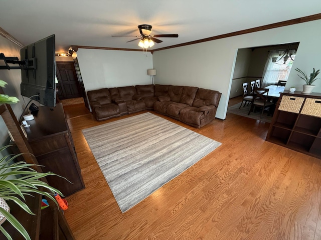 1819 Walnut Rd, Heath, OH 43056 - living room with a ceiling fan, wood finished floors, and ornamental molding