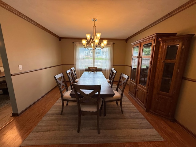 1819 Walnut Rd, Heath, OH 43056 - dining area with a chandelier, wood finished floors, and ornamental molding