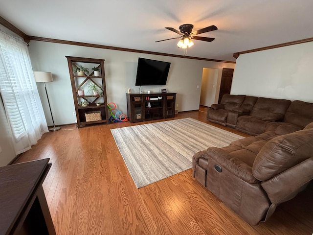 1819 Walnut Rd, Heath, OH 43056 - living area featuring a ceiling fan, wood finished floors, and crown molding