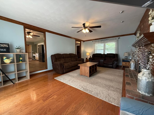 1819 Walnut Rd, Heath, OH 43056 - living room featuring a ceiling fan, ornamental molding, and wood finished floors