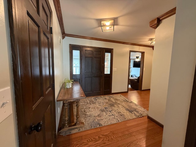 1819 Walnut Rd, Heath, OH 43056 - foyer entrance featuring wood finished floors and crown molding