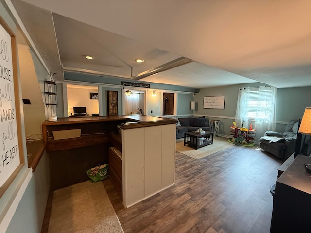 1819 Walnut Rd, Heath, OH 43056 - kitchen with wood finished floors, recessed lighting, open floor plan, dark countertops, and wainscoting