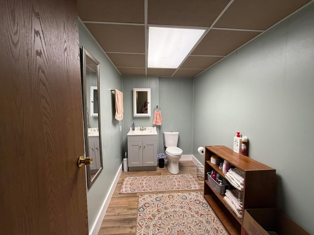 1819 Walnut Rd, Heath, OH 43056 - bathroom featuring vanity, a drop ceiling, and wood finished floors