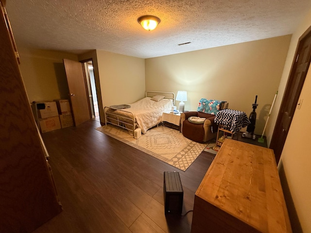 1819 Walnut Rd, Heath, OH 43056 - bedroom with wood finished floors and a textured ceiling