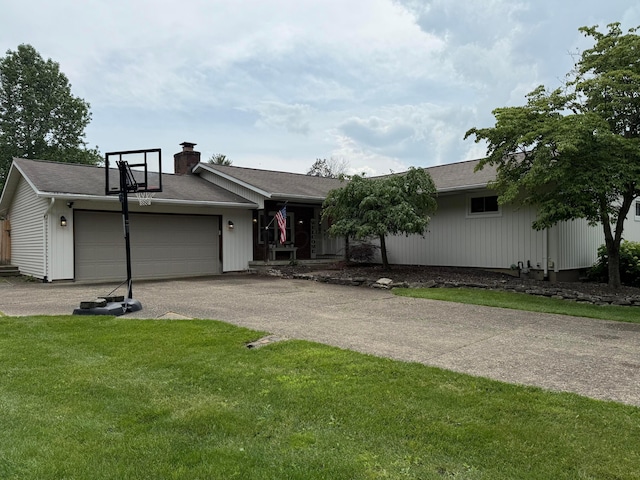 1819 Walnut Rd, Heath, OH 43056 - view of front facade with a garage, asphalt driveway, a chimney, and a front yard