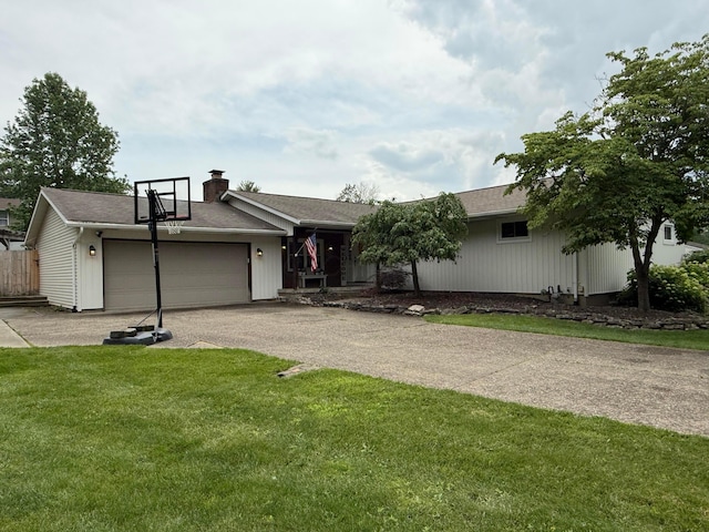 1819 Walnut Rd, Heath, OH 43056 - view of front facade featuring a garage, driveway, and a chimney
