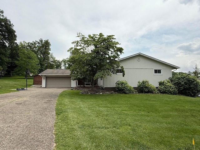1819 Walnut Rd, Heath, OH 43056 - view of front facade featuring driveway, a garage, and a front lawn