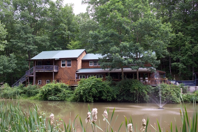 6598 Jeff Ln, Athens, OH 45701 - rear view of property featuring a water view, a metal roof, and a view of trees