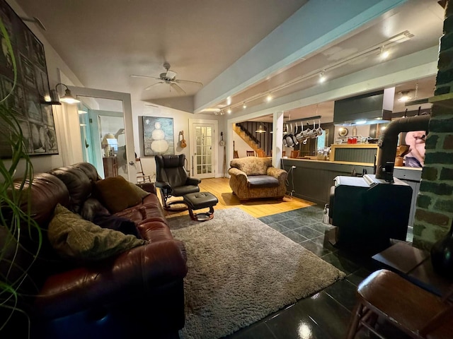 6598 Jeff Ln, Athens, OH 45701 - living area featuring ceiling fan, rail lighting, and stairs