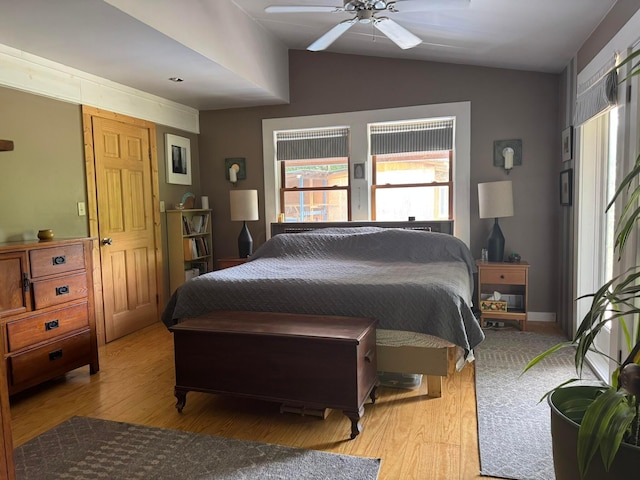 6598 Jeff Ln, Athens, OH 45701 - bedroom with multiple windows, vaulted ceiling, light wood-style flooring, and ceiling fan