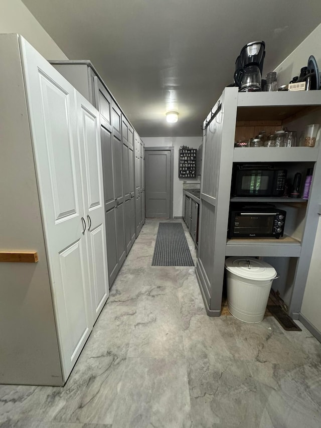 6598 Jeff Ln, Athens, OH 45701 - kitchen featuring black microwave and gray cabinets