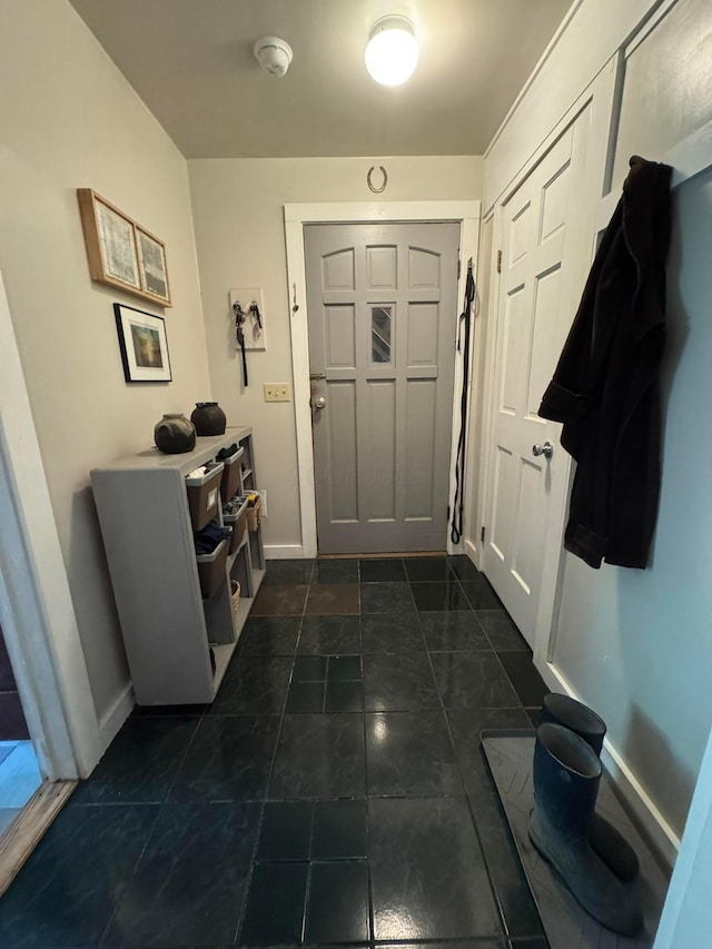6598 Jeff Ln, Athens, OH 45701 - foyer entrance featuring baseboards and dark tile patterned flooring
