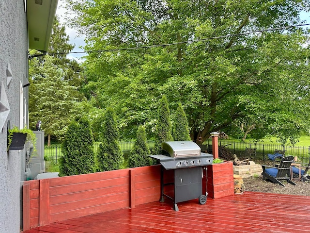 6869 Cedar Brook Pl, New Albany, OH 43054 - wooden deck featuring a fenced backyard, grilling area, and view of scattered trees