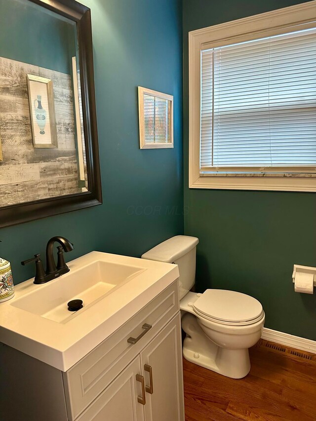 6869 Cedar Brook Pl, New Albany, OH 43054 - half bath with vanity and wood finished floors