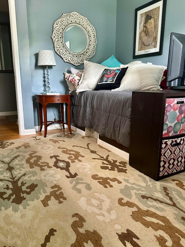 6869 Cedar Brook Pl, New Albany, OH 43054 - bedroom featuring baseboards and wood finished floors