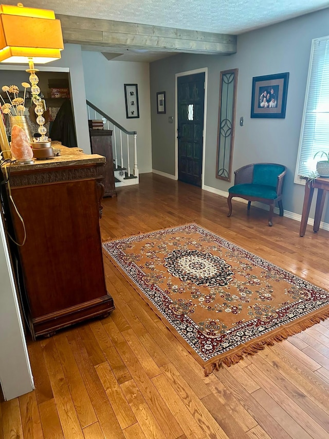 6869 Cedar Brook Pl, New Albany, OH 43054 - foyer with stairs, hardwood / wood-style flooring, and beamed ceiling