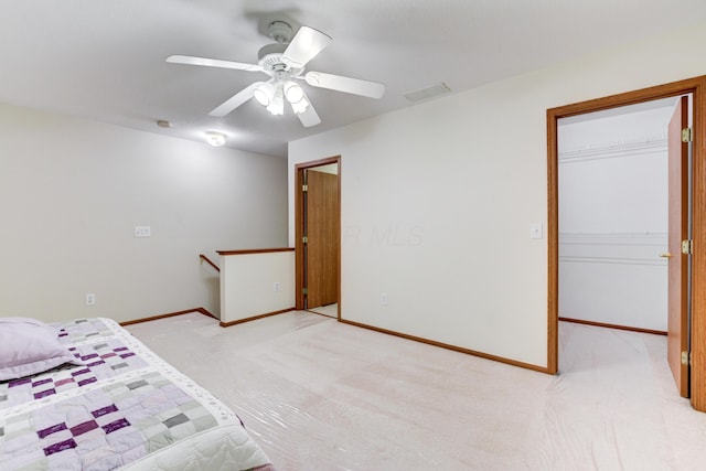 151 Cameron Ridge Dr, Columbus, OH 43235 - unfurnished bedroom featuring light carpet, a walk in closet, ceiling fan, and a closet