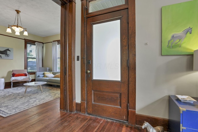 300 E Main St, Somerset, OH 43783 - entrance foyer with dark wood-style floors and a chandelier