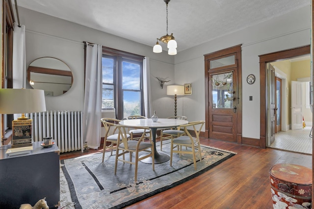 300 E Main St, Somerset, OH 43783 - dining room featuring radiator and hardwood / wood-style flooring