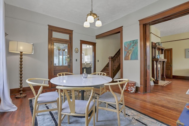 300 E Main St, Somerset, OH 43783 - dining space featuring stairway, wood finished floors, and a textured ceiling