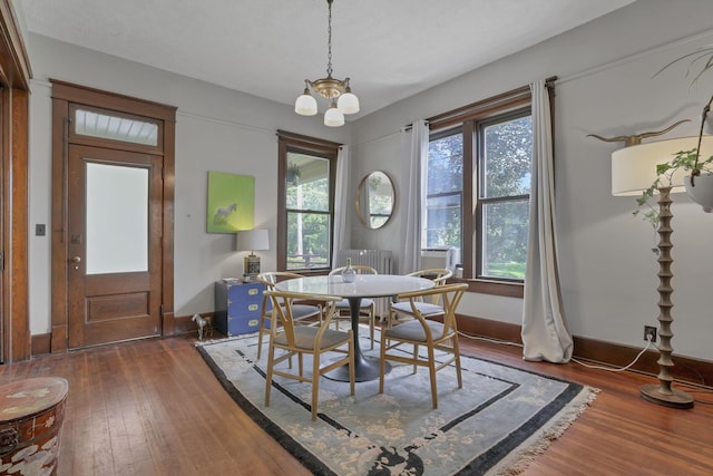 300 E Main St, Somerset, OH 43783 - dining space with hardwood / wood-style flooring and a chandelier