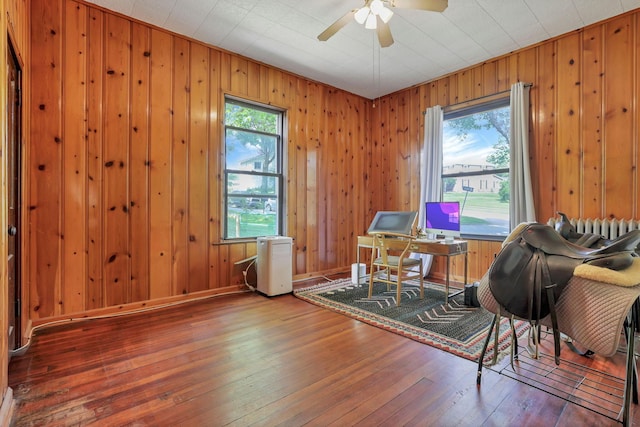 300 E Main St, Somerset, OH 43783 - office area with hardwood / wood-style floors, ceiling fan, and wooden walls