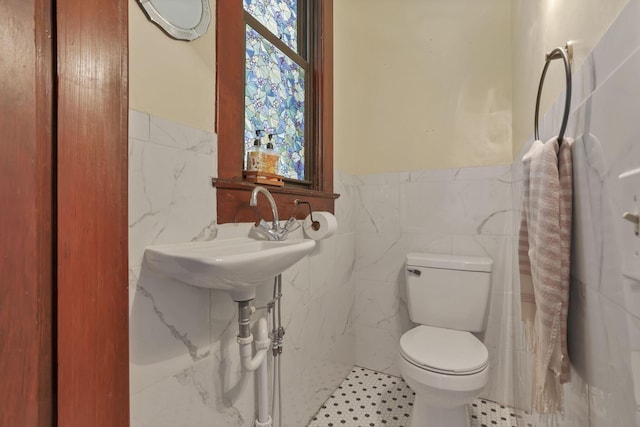 300 E Main St, Somerset, OH 43783 - half bathroom featuring tile walls and wainscoting