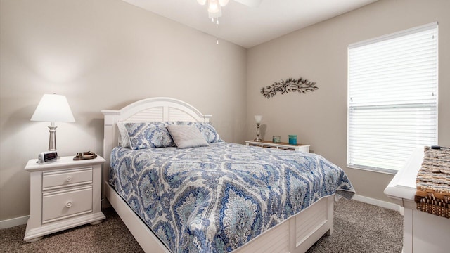 7087 Ribault Dr NW, Pickerington, OH 43147 - bedroom with dark carpet and a ceiling fan