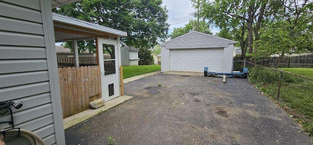 7358 Roshon Ave, Reynoldsburg, OH 43068 - view of patio with a detached garage and an outbuilding