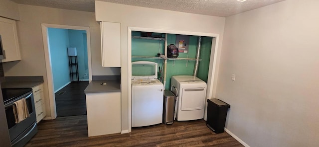 7358 Roshon Ave, Reynoldsburg, OH 43068 - laundry room with washing machine and clothes dryer, dark wood-style flooring, and a textured ceiling