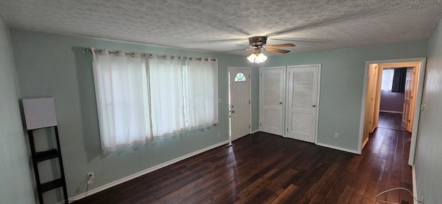 7358 Roshon Ave, Reynoldsburg, OH 43068 - foyer entrance featuring dark wood-type flooring, ceiling fan, plenty of natural light, and a textured ceiling